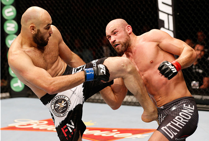STOCKHOLM, SWEDEN - OCTOBER 04: (L-R) Gasan Umalatov of Russia kicks Cathal Pendred of Ireland in their welterweight bout at the Ericsson Globe Arena on October 4, 2014 in Stockholm, Sweden. (Photo by Josh Hedges/Zuffa LLC/Zuffa LLC)