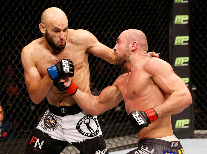 STOCKHOLM, SWEDEN - OCTOBER 04: (R-L) Cathal Pendred of Ireland punches Gasan Umalatov of Russia in their welterweight bout at the Ericsson Globe Arena on October 4, 2014 in Stockholm, Sweden. (Photo by Josh Hedges/Zuffa LLC/Zuffa LLC)