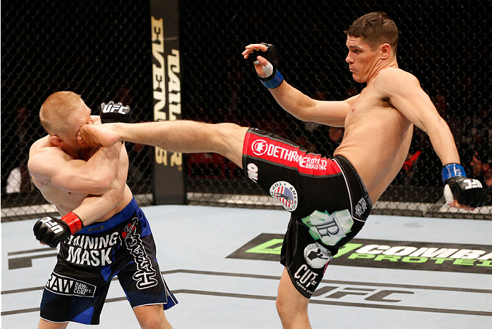 STOCKHOLM, SWEDEN - OCTOBER 04: (R-L) Charles Rosa kicks Dennis Siver of Germany in their featherweight bout at the Ericsson Globe Arena on October 4, 2014 in Stockholm, Sweden. (Photo by Josh Hedges/Zuffa LLC/Zuffa LLC)