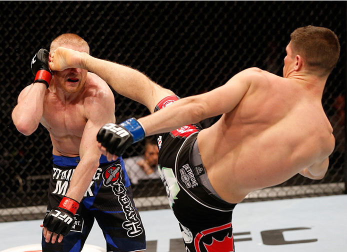 STOCKHOLM, SWEDEN - OCTOBER 04: (R-L) Charles Rosa kicks Dennis Siver of Germany in their featherweight bout at the Ericsson Globe Arena on October 4, 2014 in Stockholm, Sweden. (Photo by Josh Hedges/Zuffa LLC/Zuffa LLC)