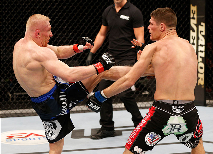 STOCKHOLM, SWEDEN - OCTOBER 04: (L-R) Dennis Siver of Germany kicks Charles Rosa in their featherweight bout at the Ericsson Globe Arena on October 4, 2014 in Stockholm, Sweden. (Photo by Josh Hedges/Zuffa LLC/Zuffa LLC)