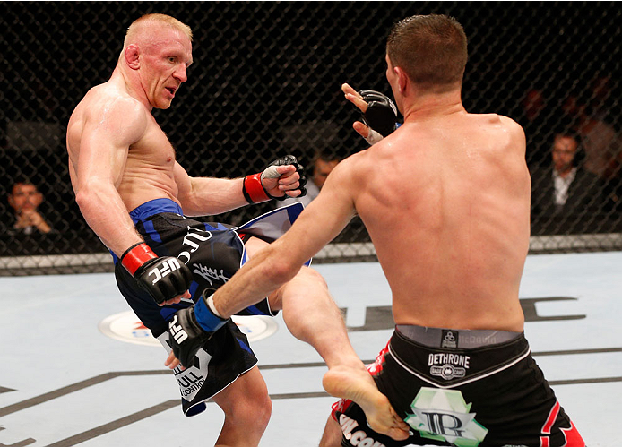 STOCKHOLM, SWEDEN - OCTOBER 04: (L-R) Dennis Siver of Germany kicks Charles Rosa in their featherweight bout at the Ericsson Globe Arena on October 4, 2014 in Stockholm, Sweden. (Photo by Josh Hedges/Zuffa LLC/Zuffa LLC)