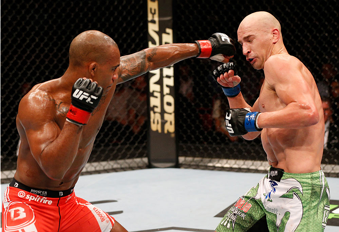 STOCKHOLM, SWEDEN - OCTOBER 04: (L-R) Nico Musoke of Sweden punches Alexander Yakovlev of Russia in their welterweight bout at the Ericsson Globe Arena on October 4, 2014 in Stockholm, Sweden. (Photo by Josh Hedges/Zuffa LLC/Zuffa LLC)