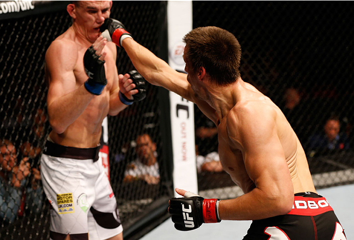 STOCKHOLM, SWEDEN - OCTOBER 04: (R-L) Magnus Cedenblad of Sweden punches Scott Askham of England in their middleweight bout at the Ericsson Globe Arena on October 4, 2014 in Stockholm, Sweden. (Photo by Josh Hedges/Zuffa LLC/Zuffa LLC)