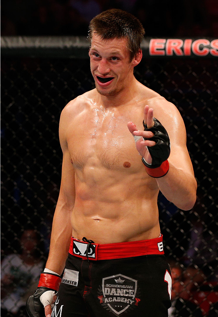 STOCKHOLM, SWEDEN - OCTOBER 04: Magnus Cedenblad of Sweden smiles at opponent Scott Askham of England between rounds of their middleweight bout at the Ericsson Globe Arena on October 4, 2014 in Stockholm, Sweden. (Photo by Josh Hedges/Zuffa LLC/Zuffa LL