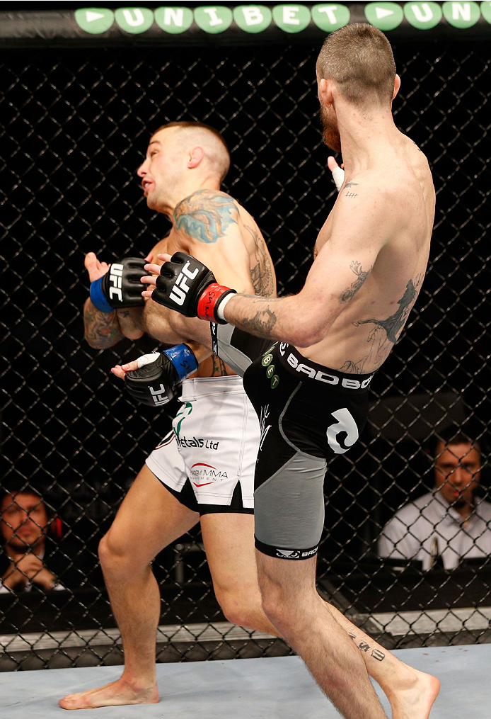 STOCKHOLM, SWEDEN - OCTOBER 04: (R-L) Niklas Backstrom of Sweden lands a front kick to the face of Mike Wilkinson of England in their featherweight bout at the Ericsson Globe Arena on October 4, 2014 in Stockholm, Sweden. (Photo by Josh Hedges/Zuffa LLC