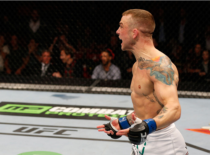 STOCKHOLM, SWEDEN - OCTOBER 04: Mike Wilkinson of England celebrates after his knockout victory over Niklas Backstrom of Sweden in their featherweight bout at the Ericsson Globe Arena on October 4, 2014 in Stockholm, Sweden. (Photo by Josh Hedges/Zuffa
