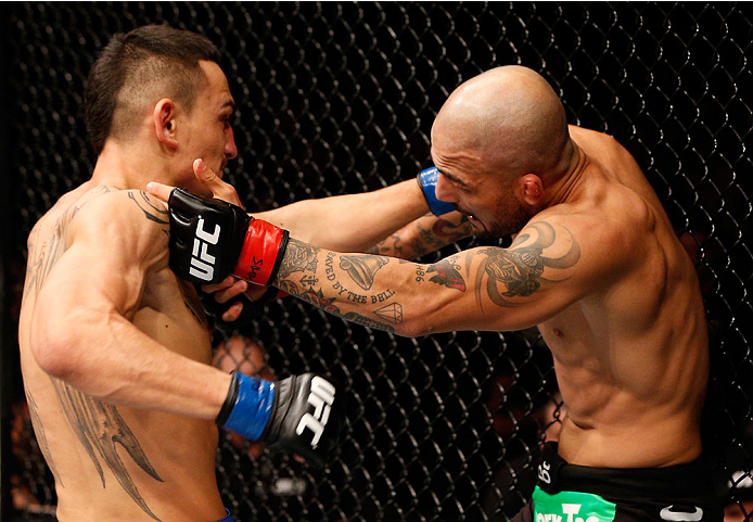 STOCKHOLM, SWEDEN - OCTOBER 04: (L-R) Max Holloway punches Akira Corassani of Sweden in their featherweight bout at the Ericsson Globe Arena on October 4, 2014 in Stockholm, Sweden. (Photo by Josh Hedges/Zuffa LLC/Zuffa LLC)