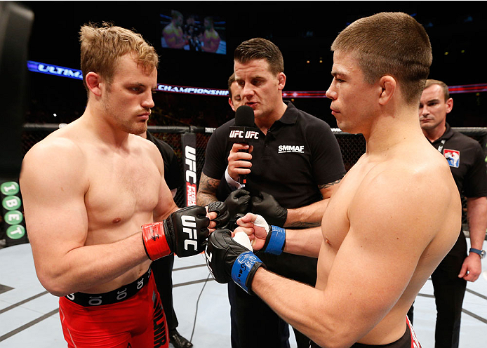 STOCKHOLM, SWEDEN - OCTOBER 04: (L-R) Opponents Gunnar Nelson of Iceland and Rick Story face off in the Octagon before their welterweight bout at the Ericsson Globe Arena on October 4, 2014 in Stockholm, Sweden. (Photo by Josh Hedges/Zuffa LLC/Zuffa LLC