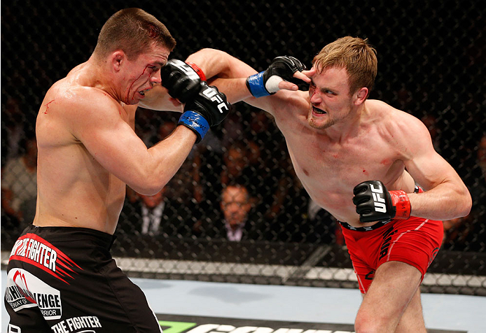 STOCKHOLM, SWEDEN - OCTOBER 04: (R-L) Gunnar Nelson of Iceland punches Rick Story in their welterweight bout at the Ericsson Globe Arena on October 4, 2014 in Stockholm, Sweden. (Photo by Josh Hedges/Zuffa LLC/Zuffa LLC)