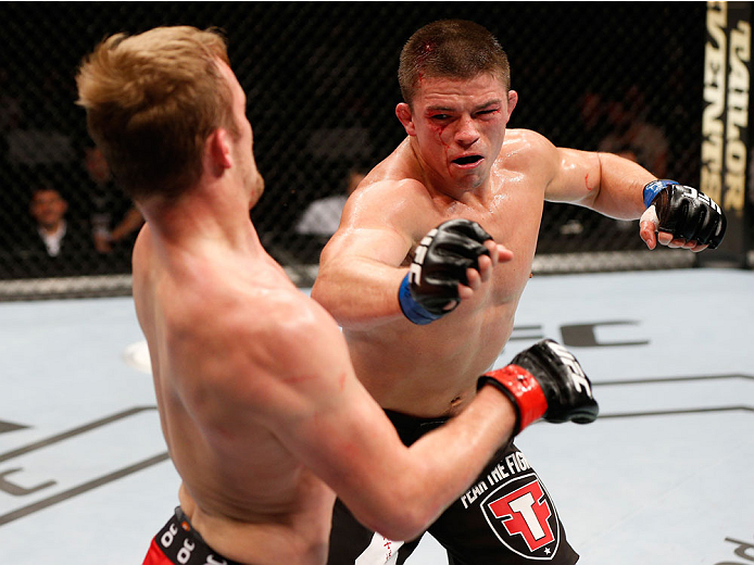 STOCKHOLM, SWEDEN - OCTOBER 04: (R-L) Rick Story punches Gunnar Nelson of Iceland in their welterweight bout at the Ericsson Globe Arena on October 4, 2014 in Stockholm, Sweden. (Photo by Josh Hedges/Zuffa LLC/Zuffa LLC)