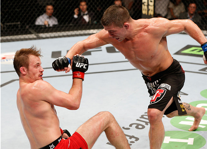 STOCKHOLM, SWEDEN - OCTOBER 04: (R-L) Rick Story knocks down Gunnar Nelson of Iceland with a punch in their welterweight bout at the Ericsson Globe Arena on October 4, 2014 in Stockholm, Sweden. (Photo by Josh Hedges/Zuffa LLC/Zuffa LLC)