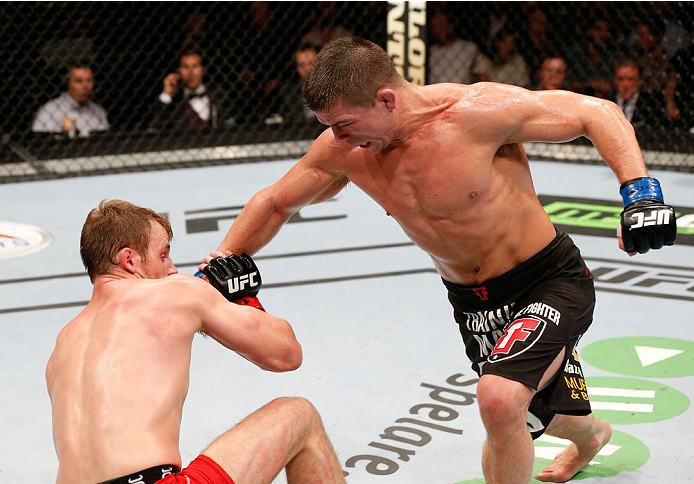 STOCKHOLM, SWEDEN - OCTOBER 04: (R-L) Rick Story knocks down Gunnar Nelson of Iceland with a punch in their welterweight bout at the Ericsson Globe Arena on October 4, 2014 in Stockholm, Sweden. (Photo by Josh Hedges/Zuffa LLC/Zuffa LLC)