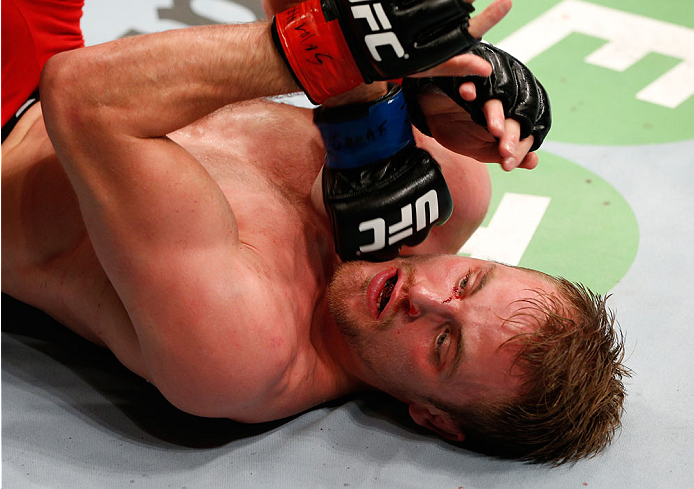 STOCKHOLM, SWEDEN - OCTOBER 04: (L-R) Rick Story punches Gunnar Nelson of Iceland after a knockdown in their welterweight bout at the Ericsson Globe Arena on October 4, 2014 in Stockholm, Sweden. (Photo by Josh Hedges/Zuffa LLC/Zuffa LLC)