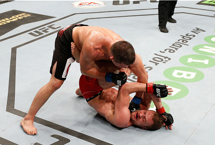 STOCKHOLM, SWEDEN - OCTOBER 04: (L-R) Rick Story punches Gunnar Nelson of Iceland after a knockdown in their welterweight bout at the Ericsson Globe Arena on October 4, 2014 in Stockholm, Sweden. (Photo by Josh Hedges/Zuffa LLC/Zuffa LLC)