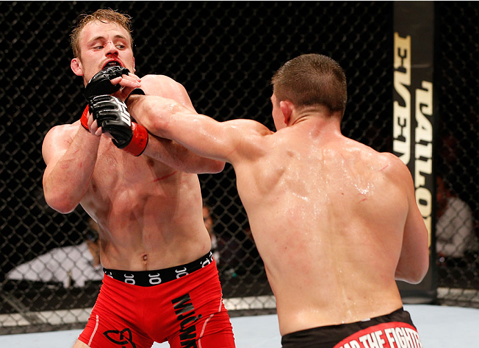 STOCKHOLM, SWEDEN - OCTOBER 04: (R-L) Rick Story punches Gunnar Nelson of Iceland in their welterweight bout at the Ericsson Globe Arena on October 4, 2014 in Stockholm, Sweden. (Photo by Josh Hedges/Zuffa LLC/Zuffa LLC)