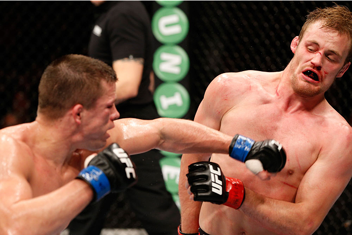 STOCKHOLM, SWEDEN - OCTOBER 04: (l-R) Rick Story punches Gunnar Nelson of Iceland in their welterweight bout at the Ericsson Globe Arena on October 4, 2014 in Stockholm, Sweden. (Photo by Josh Hedges/Zuffa LLC/Zuffa LLC)