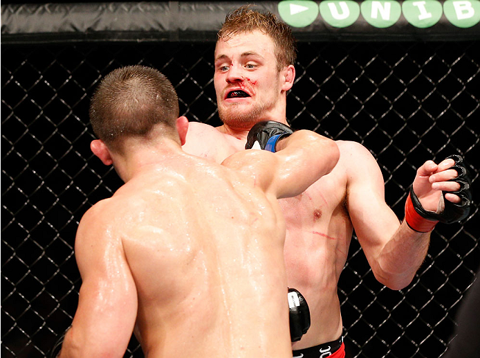 STOCKHOLM, SWEDEN - OCTOBER 04: (L-R) Rick Story punches Gunnar Nelson of Iceland in their welterweight bout at the Ericsson Globe Arena on October 4, 2014 in Stockholm, Sweden. (Photo by Josh Hedges/Zuffa LLC/Zuffa LLC)