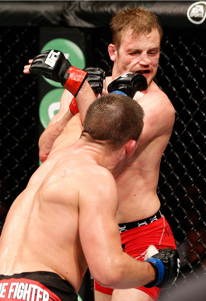 STOCKHOLM, SWEDEN - OCTOBER 04: (l-R) Rick Story punches Gunnar Nelson of Iceland in their welterweight bout at the Ericsson Globe Arena on October 4, 2014 in Stockholm, Sweden. (Photo by Josh Hedges/Zuffa LLC/Zuffa LLC)