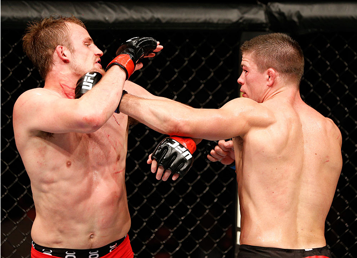 STOCKHOLM, SWEDEN - OCTOBER 04: (R-L) Rick Story punches Gunnar Nelson of Iceland in their welterweight bout at the Ericsson Globe Arena on October 4, 2014 in Stockholm, Sweden. (Photo by Josh Hedges/Zuffa LLC/Zuffa LLC)