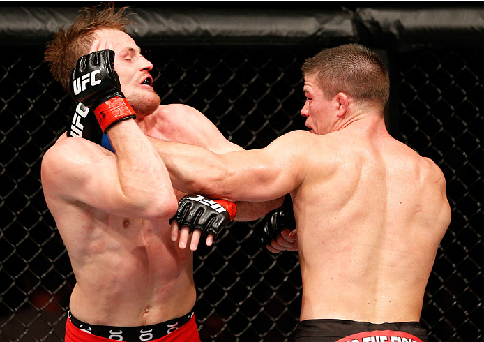 STOCKHOLM, SWEDEN - OCTOBER 04: (R-L) Rick Story punches Gunnar Nelson of Iceland in their welterweight bout at the Ericsson Globe Arena on October 4, 2014 in Stockholm, Sweden. (Photo by Josh Hedges/Zuffa LLC/Zuffa LLC)