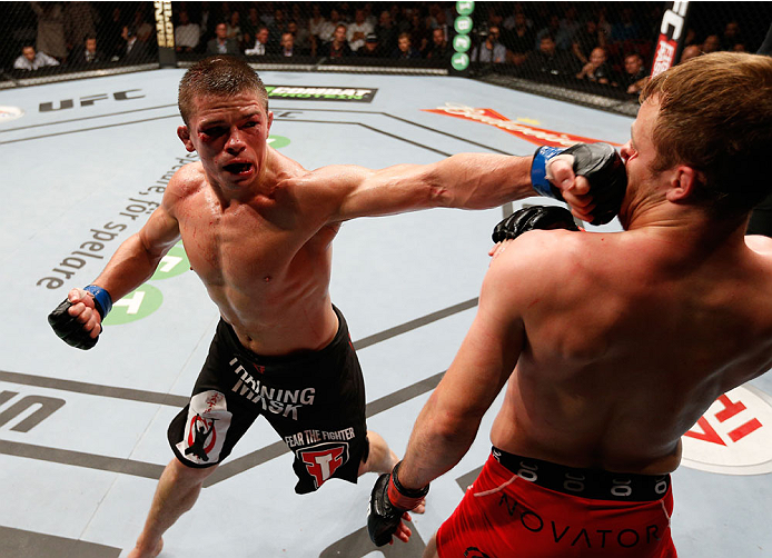 STOCKHOLM, SWEDEN - OCTOBER 04: (L-R) Rick Story punches Gunnar Nelson of Iceland in their welterweight bout at the Ericsson Globe Arena on October 4, 2014 in Stockholm, Sweden. (Photo by Josh Hedges/Zuffa LLC/Zuffa LLC)