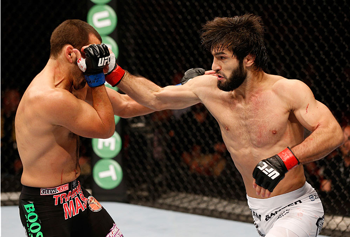 STOCKHOLM, SWEDEN - OCTOBER 04: (R-L) Zubaira Tukhugov of Russia punches Ernest Chavez in their featherweight bout at the Ericsson Globe Arena on October 4, 2014 in Stockholm, Sweden. (Photo by Josh Hedges/Zuffa LLC/Zuffa LLC)