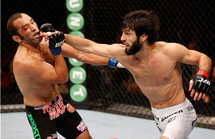 STOCKHOLM, SWEDEN - OCTOBER 04: (R-L) Zubaira Tukhugov of Russia punches Ernest Chavez in their featherweight bout at the Ericsson Globe Arena on October 4, 2014 in Stockholm, Sweden. (Photo by Josh Hedges/Zuffa LLC/Zuffa LLC)