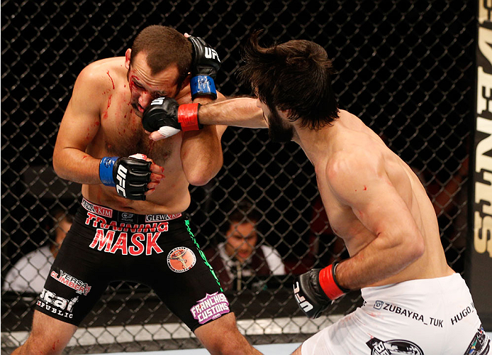 STOCKHOLM, SWEDEN - OCTOBER 04: (R-L) Zubaira Tukhugov of Russia punches Ernest Chavez in their featherweight bout at the Ericsson Globe Arena on October 4, 2014 in Stockholm, Sweden. (Photo by Josh Hedges/Zuffa LLC/Zuffa LLC)