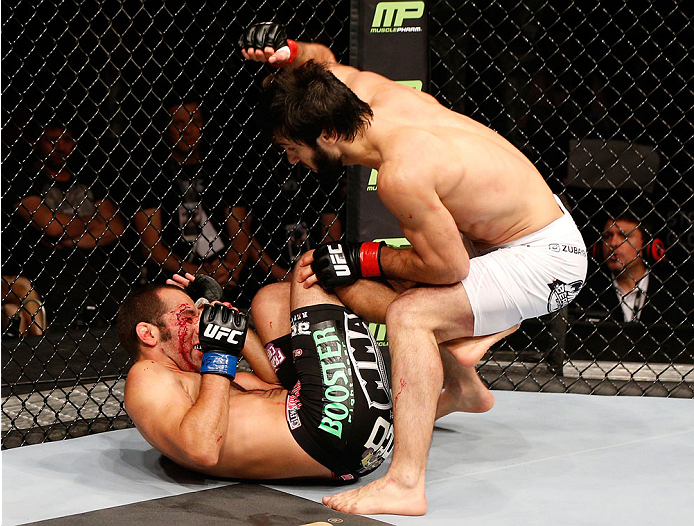 STOCKHOLM, SWEDEN - OCTOBER 04: (R-L) Zubaira Tukhugov of Russia punches Ernest Chavez in their featherweight bout at the Ericsson Globe Arena on October 4, 2014 in Stockholm, Sweden. (Photo by Josh Hedges/Zuffa LLC/Zuffa LLC)
