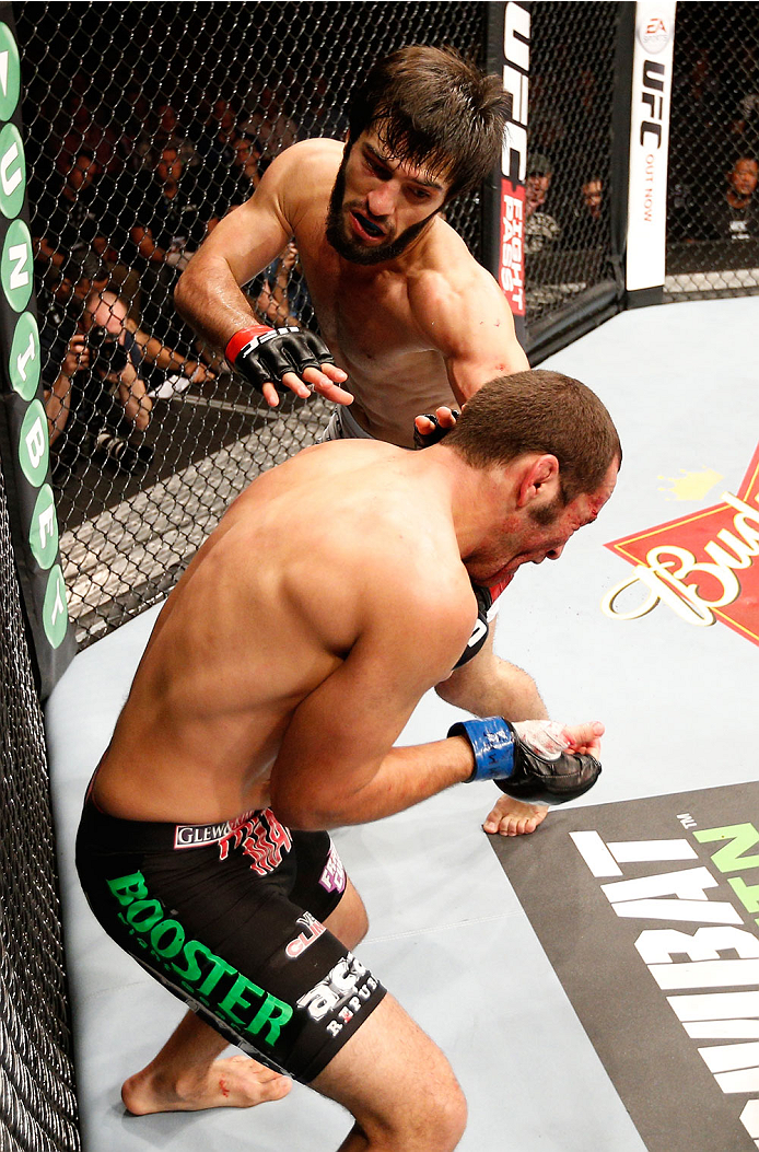 STOCKHOLM, SWEDEN - OCTOBER 04: (L-R) Zubaira Tukhugov of Russia punches Ernest Chavez in their featherweight bout at the Ericsson Globe Arena on October 4, 2014 in Stockholm, Sweden. (Photo by Josh Hedges/Zuffa LLC/Zuffa LLC)