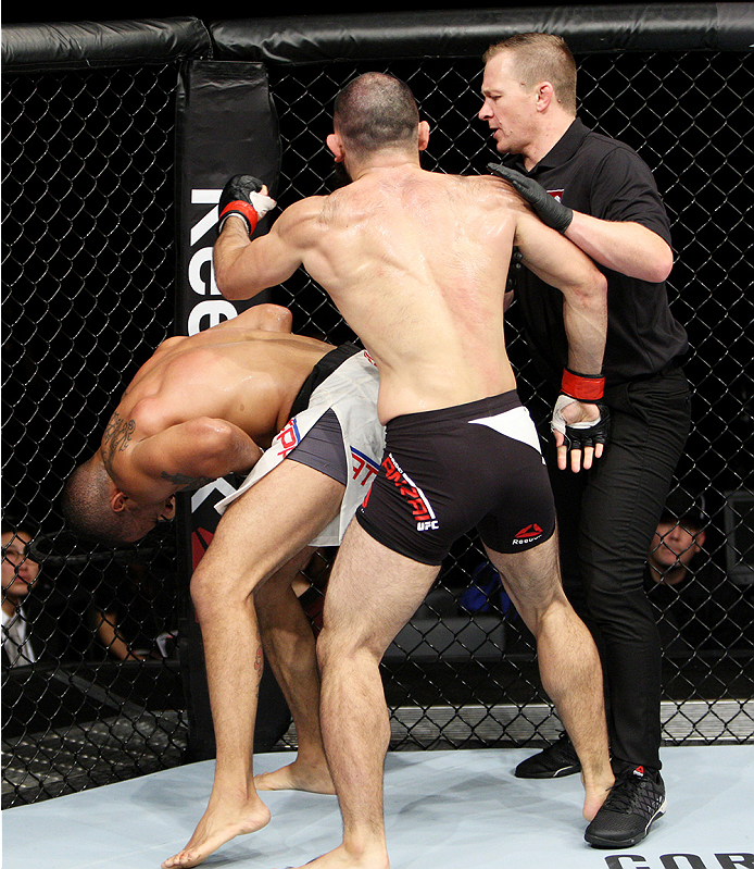 SAITAMA, JAPAN - SEPTEMBER 27: The UFC official waves off the fight after Roger Zapata of the Dominican Republic bent over in pain during his fight with Shinsho Anzai of Japan in their welterweight bout during the UFC event at the Saitama Super Arena on