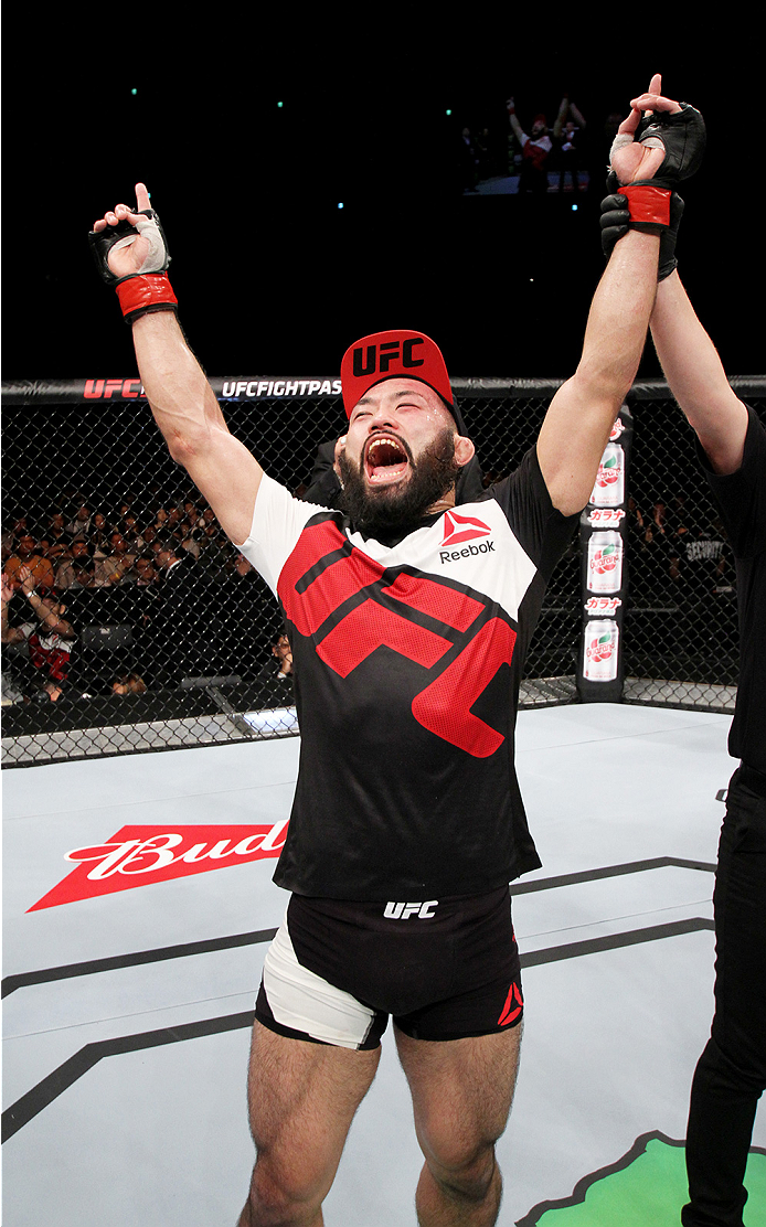 SAITAMA, JAPAN - SEPTEMBER 27: Shinsho Anzai of Japan celebrates his win over Roger Zapata of the Dominican Republic in their welterweight bout during the UFC event at the Saitama Super Arena on September 27, 2015 in Saitama, Japan. (Photo by Mitch Vique
