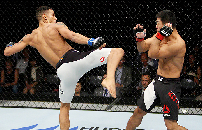 SAITAMA, JAPAN - SEPTEMBER 27: Kajan Johnson of Canada goes fora kick on Naoyuki Kotani of Japan in their lightweight bout during the UFC event at the Saitama Super Arena on September 27, 2015 in Saitama, Japan. (Photo by Mitch Viquez/Zuffa LLC/Zuffa LLC