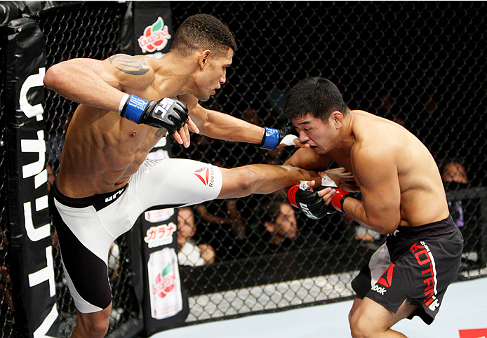 SAITAMA, JAPAN - SEPTEMBER 27: Naoyuki Kotani of Japan catches a kick by Kajan Johnson of Canada in their lightweight bout during the UFC event at the Saitama Super Arena on September 27, 2015 in Saitama, Japan. (Photo by Mitch Viquez/Zuffa LLC/Zuffa LL