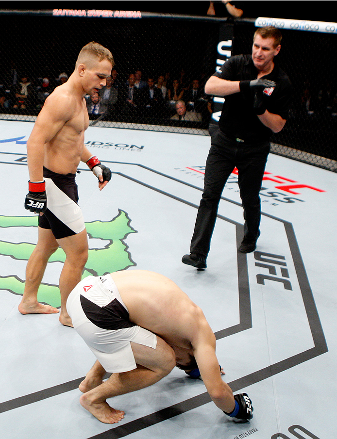 SAITAMA, JAPAN - SEPTEMBER 27: The UFC referee calls a time out after Nick Hein of Germany incidental groin shot on Yusuke Kasuya of Japan in their lightweight bout during the UFC event at the Saitama Super Arena on September 27, 2015 in Saitama, Japan.