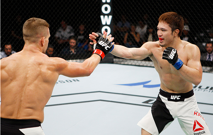 SAITAMA, JAPAN - SEPTEMBER 27: (From L to R) Nick Hein of Germany and Yusuke Kasuya of Japan slap hands in their lightweight bout during the UFC event at the Saitama Super Arena on September 27, 2015 in Saitama, Japan. (Photo by Mitch Viquez/Zuffa LLC/