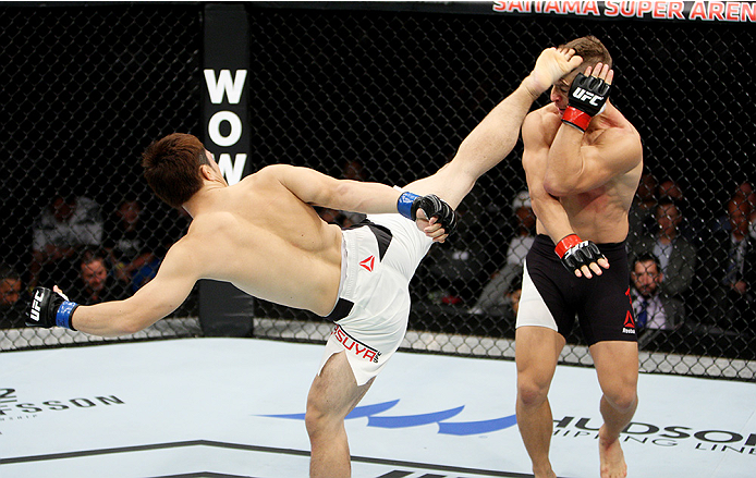 SAITAMA, JAPAN - SEPTEMBER 27: Yusuke Kasuya of Japan kicks Nick Hein of Germany in their lightweight bout during the UFC event at the Saitama Super Arena on September 27, 2015 in Saitama, Japan. (Photo by Mitch Viquez/Zuffa LLC/Zuffa LLC via Getty Image