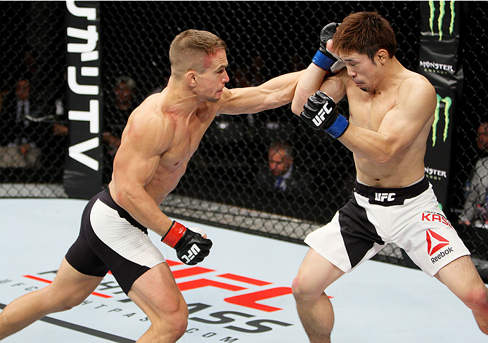 SAITAMA, JAPAN - SEPTEMBER 27: Nick Hein of Germany punches Yusuke Kasuya of Japan in their lightweight bout during the UFC event at the Saitama Super Arena on September 27, 2015 in Saitama, Japan. (Photo by Mitch Viquez/Zuffa LLC/Zuffa LLC via Getty Ima