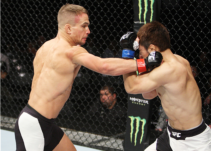 SAITAMA, JAPAN - SEPTEMBER 27: Nick Hein of Germany punches Yusuke Kasuya of Japan in their lightweight bout during the UFC event at the Saitama Super Arena on September 27, 2015 in Saitama, Japan. (Photo by Mitch Viquez/Zuffa LLC/Zuffa LLC via Getty Ima