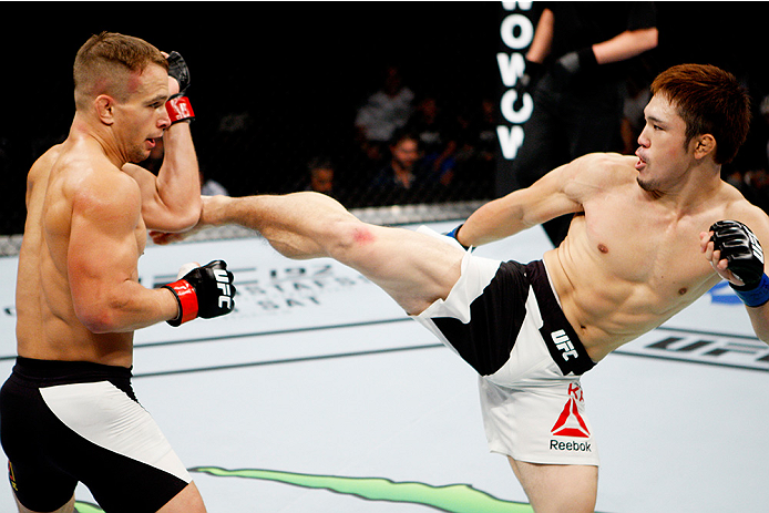SAITAMA, JAPAN - SEPTEMBER 27: Yusuke Kasuya of Japan kicks Nick Hein of Germany in their lightweight bout during the UFC event at the Saitama Super Arena on September 27, 2015 in Saitama, Japan. (Photo by Mitch Viquez/Zuffa LLC/Zuffa LLC via Getty Image