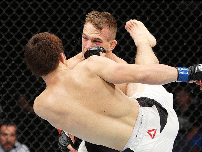 SAITAMA, JAPAN - SEPTEMBER 27: Yusuke Kasuya of Japan kicks Nick Hein of Germany in their lightweight bout during the UFC event at the Saitama Super Arena on September 27, 2015 in Saitama, Japan. (Photo by Mitch Viquez/Zuffa LLC/Zuffa LLC via Getty Image
