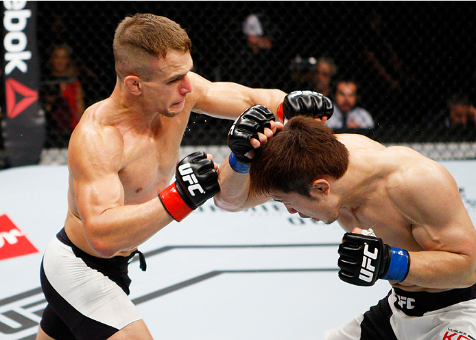 SAITAMA, JAPAN - SEPTEMBER 27: Nick Hein of Germany punches Yusuke Kasuya of Japan in their lightweight bout during the UFC event at the Saitama Super Arena on September 27, 2015 in Saitama, Japan. (Photo by Mitch Viquez/Zuffa LLC/Zuffa LLC via Getty Ima
