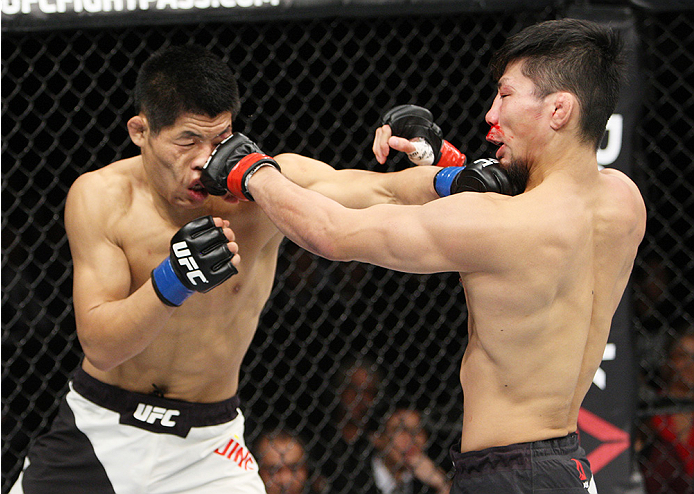 SAITAMA, JAPAN - SEPTEMBER 27: (From L to R) Li Jingliang of China and Keita Nakamura of Japan look for openings in their welterweight bout during the UFC event at the Saitama Super Arena on September 27, 2015 in Saitama, Japan. (Photo by Mitch Viquez/Zuf