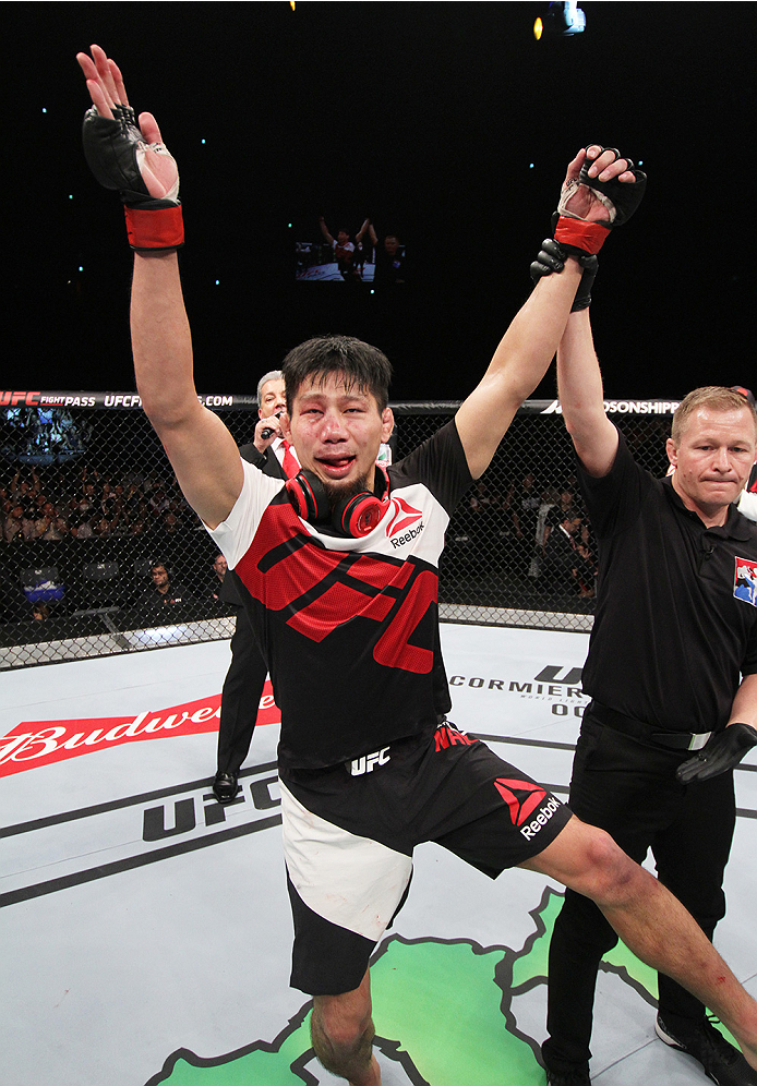 SAITAMA, JAPAN - SEPTEMBER 27: Keita Nakamura of Japan celebrates his win over Li Jingliang of China in their welterweight bout during the UFC event at the Saitama Super Arena on September 27, 2015 in Saitama, Japan. (Photo by Mitch Viquez/Zuffa LLC/Zuff
