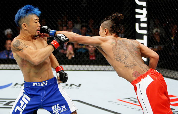 SAITAMA, JAPAN - SEPTEMBER 27: Teruto Ishihara of Japan punches Mizuto Hirota of Japan in their featherweight bout during the UFC event at the Saitama Super Arena on September 27, 2015 in Saitama, Japan. (Photo by Mitch Viquez/Zuffa LLC/Zuffa LLC via Get