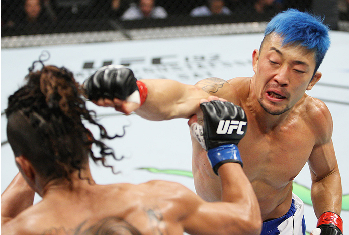 SAITAMA, JAPAN - SEPTEMBER 27: Mizuto Hirota of Japan punches Teruto Ishihara of Japan in their featherweight bout during the UFC event at the Saitama Super Arena on September 27, 2015 in Saitama, Japan. (Photo by Mitch Viquez/Zuffa LLC/Zuffa LLC via Get