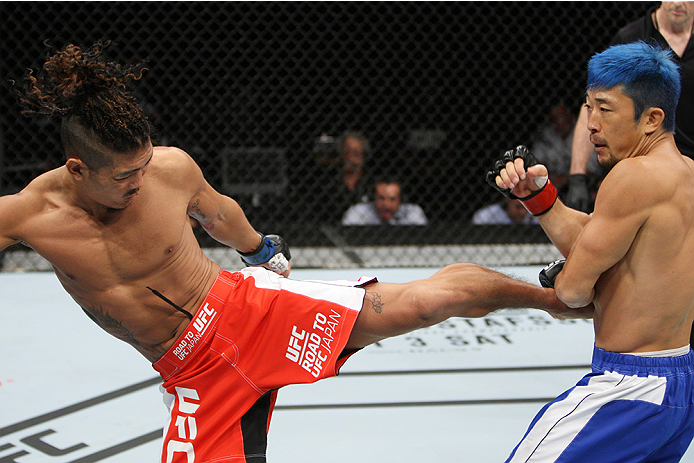 SAITAMA, JAPAN - SEPTEMBER 27: Teruto Ishihara of Japan kicks Mizuto Hirota of Japan in their featherweight bout during the UFC event at the Saitama Super Arena on September 27, 2015 in Saitama, Japan. (Photo by Mitch Viquez/Zuffa LLC/Zuffa LLC via Getty