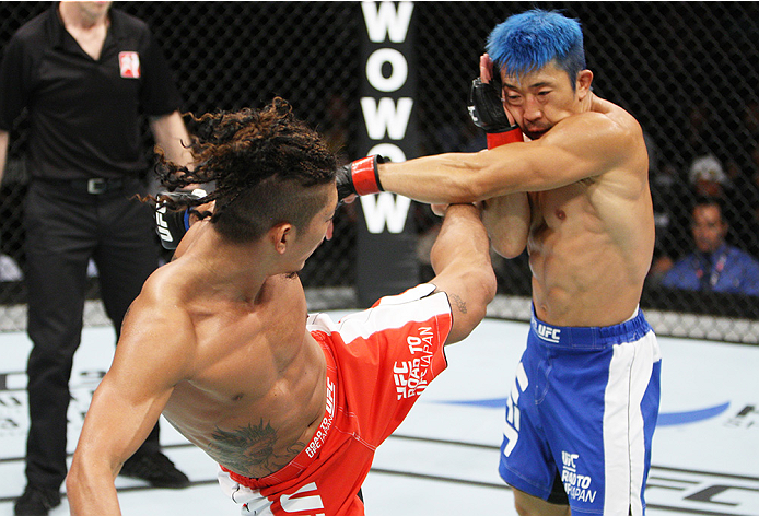 SAITAMA, JAPAN - SEPTEMBER 27: Teruto Ishihara of Japan kicks Mizuto Hirota of Japan in their featherweight bout during the UFC event at the Saitama Super Arena on September 27, 2015 in Saitama, Japan. (Photo by Mitch Viquez/Zuffa LLC/Zuffa LLC via Getty