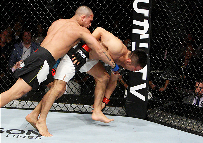 SAITAMA, JAPAN - SEPTEMBER 27: Diego Brandao of Brazil punches Katsunori Kikuno of Japan in their featherweight bout during the UFC event at the Saitama Super Arena on September 27, 2015 in Saitama, Japan. (Photo by Mitch Viquez/Zuffa LLC/Zuffa LLC via Ge